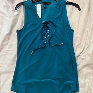Beautiful new sleeveless teal top with tie front.